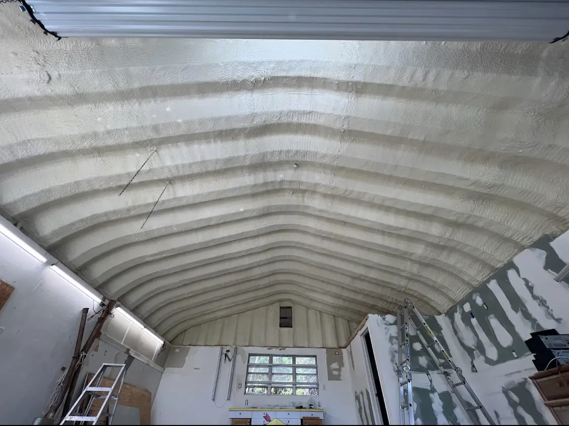 Spray polyurethane foam applied to the underside of a metal roof deck in Key Largo